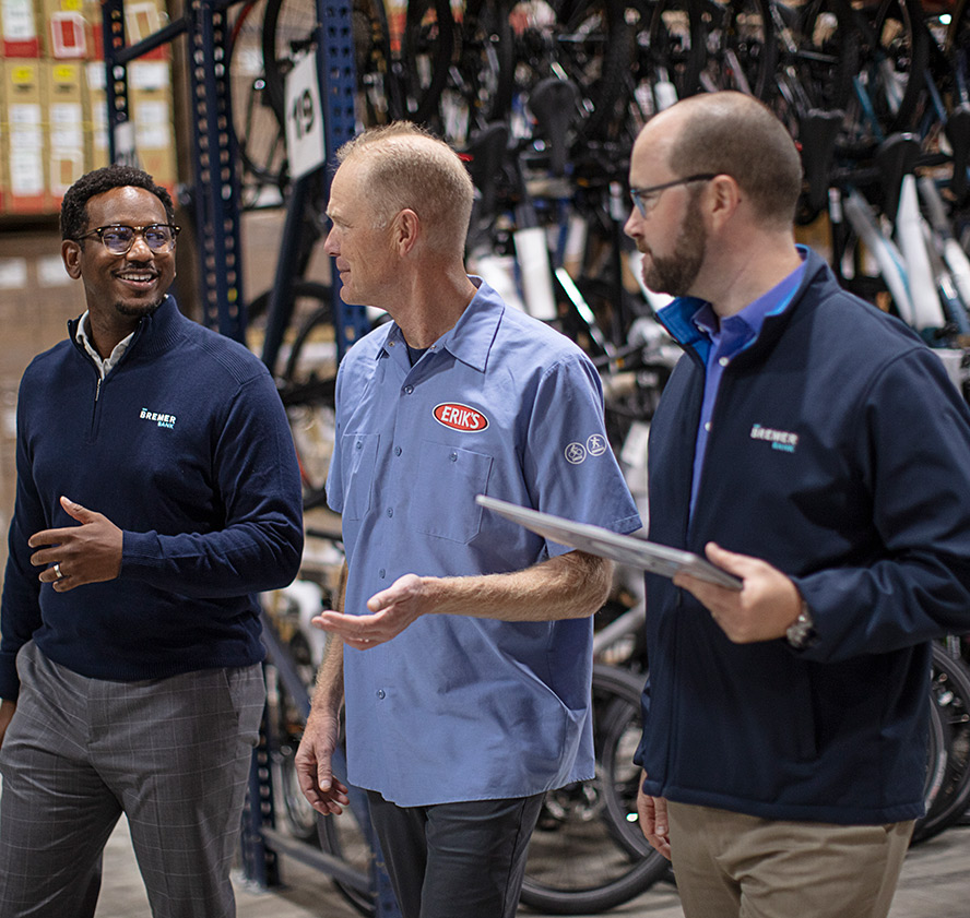 INSIGHT / BUSINESS - 3 guys in a bike shop